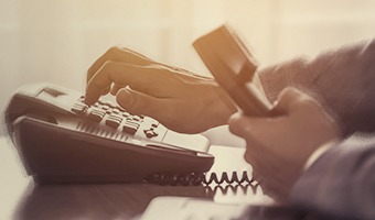 close up of person dialing a phone